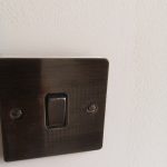 Light switches are cleaned and protected as part of the process in a Full property redecoration job