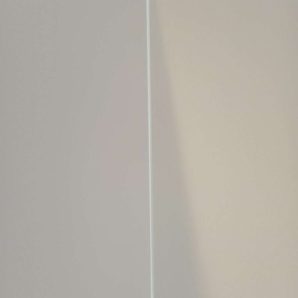 Freehand cutting in a kitchen cabinet and wall as part of a full property redecoration